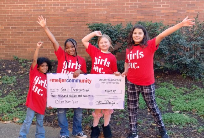 Girls holding check